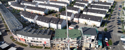 Contracting im Quartier. Luftaufnahme von mehreren Wohnkomplexen.