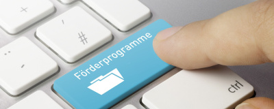 Computertastatur mit Schaltfläche "Förderprogramme"