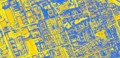 Solarkataster Hessen, Wärmebildaufnahme einer urbanen Fläche von oben in gelb, rot und blau.